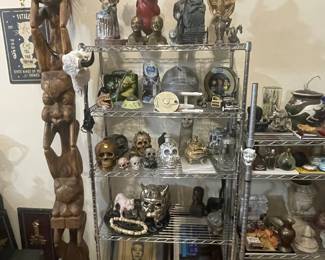 Display rack full of more eclectic home decor including figurines, decorative skulls, action figures (including Star Trek's Enterprise)
