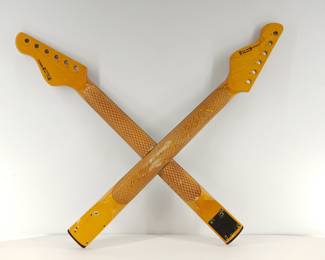 Back of two of the collection of sixteen Tagliare "Private Label" electric guitar necks