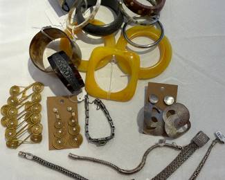 Loads of costume jewelry including bracelets, cuffs, pins, watches and more