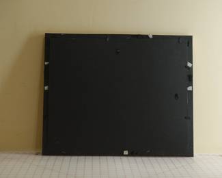 Back of ornate gilt picture frame, including white mat