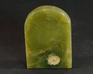 Bottom of green Jade ashtray with a skull figurine