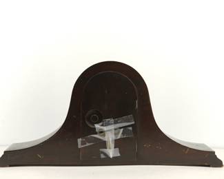 Back of antique New Haven "Chime Silent" mantle clock, including winding key