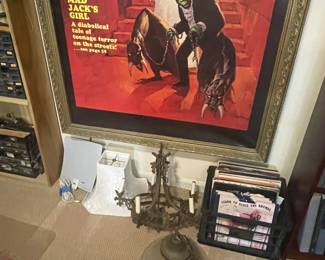 A small crate of records, cast iron chandelier, hanging glass lampshade and other lampshades