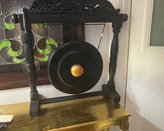 Indonesian gong with wood carvings on the top