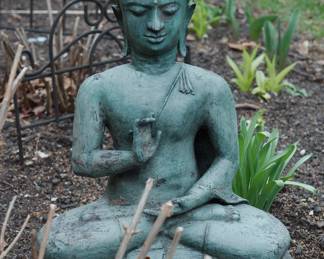 Metal meditating Buddha statue