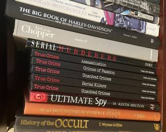 Book collection including: "The Classic Harley", "The Complete Illustrated Encyclopedia of American Motorcycles", "The Big Book of Harley-Davidson", "Art of the Chopper", "Serial Murderers", "True Crime: Assassination", "True Crime: Crimes of Passion", "True Crime: Unsolved Crimes", "True Crime: Serial Killers", "True Crime: Unsolved Crimes", "Ultimate Spy", "The Macmillan Illustrated Encyclopedia of Myths & Legends", "History of the Occult", and "Early Advertising Art"