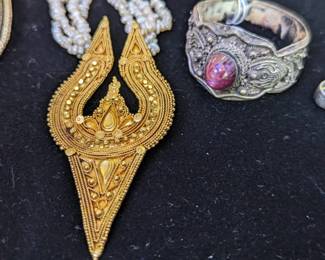 Closer view of late 19th/early 20th century high karat gold pendant + seed pearl necklace and silver + ruby adornment