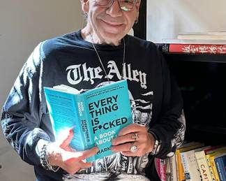 Mark Thomas, owner of The Alley and these items, shows off his treasures