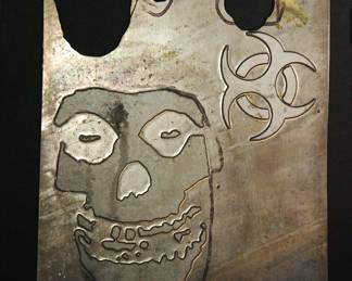 Detail of a skull on metal plates used as models when The Alley made statuary products for many major rocks groups, including AC/DC, The Ramones, The Rolling Stones, Pantera, Garbage, and Dead Kennedys