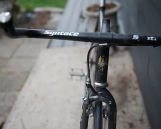 Handlebar detail of black Bianchi men's road bicycle with Syntace handlebars