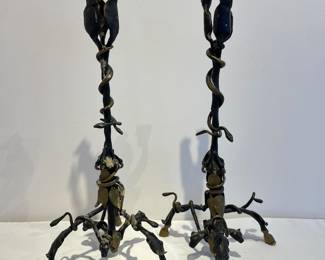Pair of bronze candelabras with dogs at the top, vines, and hooves for feet
