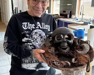 Mark Thomas, owner of The Alley and these items, shows off his treasures