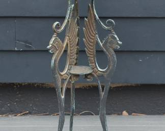 Vintage cast iron plant stand with three Griffin legs