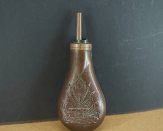 Upright view of Civil War Era military gun powder flask