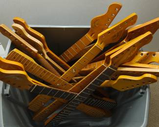Top view of full collection of sixteen Tagliare "Private Label" electric guitar necks