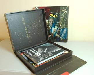 Pair of Peter Amft portfolio boxes collaged by the artist featuring Chicago Blues musicians, showing the inside of the first box