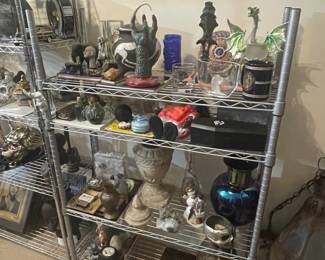 Another display rack full of eclectic home decor dragon figurines and vases