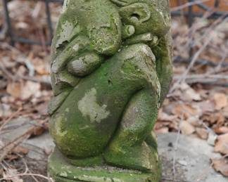 Side view of concrete weeping gargoyle