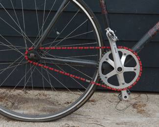 Red chain of black Bianchi men's road bicycle with Syntace handlebars