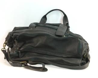 Back view of black Leather Fossil crossbody bag with spike studs on the pockets