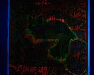 Shown under a blacklight, a different overprint of "Cheshire Cat" East Totem West and "The Eternal Now" copyright 1968 by Celestial Arts No. 3, part of "The Overprints" made in the late 1960s/early 1970s by Joe McHugh, Nick Nickolds, and Sätty, screen-printed blacklight posters