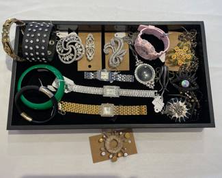 Loads of costume jewelry including bracelets, cuffs, rhinestone pins, watches and more