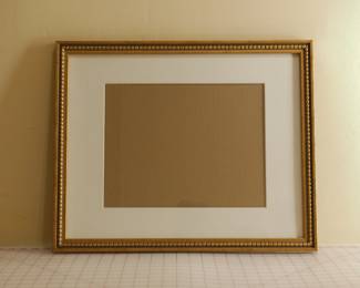 Ornate gilt picture frame, including white mat