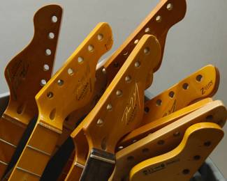Detail of the collection of sixteen Tagliare "Private Label" electric guitar necks