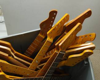 Another view of collection of sixteen Tagliare "Private Label" electric guitar necks