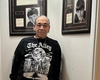 Mark Thomas, owner of The Alley and these items, shows off his treasures