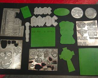 Front and backs, shown together of metal plates used as models when The Alley made statuary products for many major rocks groups, including AC/DC, The Ramones, The Rolling Stones, Pantera, Garbage, and Dead Kennedys