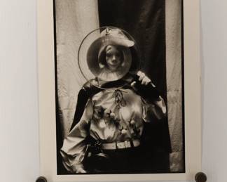 Untitled clown through a magnifying glass, signed Marc Hauser black + white silver gelatin photograph