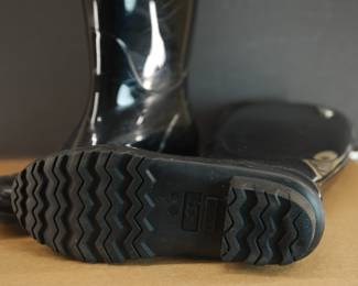 Bottom detail of black rubber Ugg galoshes, Size 9