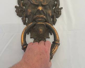Scale detail of bronze demon Gothic door knocker