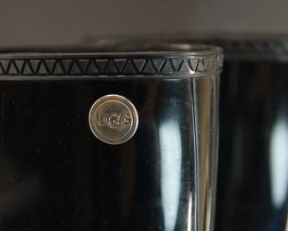 Brand detail of black rubber Ugg galoshes, Size 9