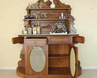 Gorgeous antique oak and marble top sideboard, shown with open drawers and open cabinet door