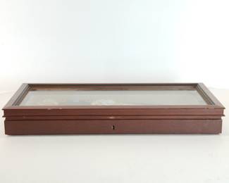 Side view of Franklin Mint "Talisman' ceremonial dagger in its display case, showing the lock