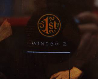 Detail of Robert Amft print, a satire of Rembrandt's "Young Woman at an Open Half-Door" with a 1st Prize stamp and Windows 2 loading logo painted into it, from the Art Institute of Chicago, signed RA '77 at bottom right