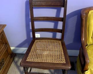 #35	Odd Cane Seat Chair w/carving on back	 $25.00 			
