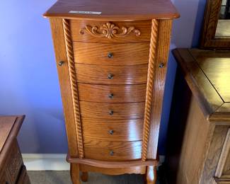 #43	Wood Jewelry Armoire - 6 drawers w/2 flip-out sides & flip-up top - 16x10x40	 $75.00 			
