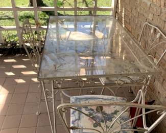 #80	Wrought Iron Metal Table w/4 chairs - Glass top 48x30x30  (has 2 arms chairs)	 $175.00 			

