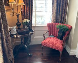 The table in the corner is a tilt top table.  