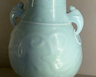 A rare moulded celadon-glazed pear-shaped archaistic 'dragon' vase, Yongzheng six-character seal mark