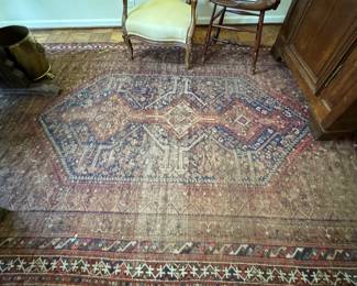 Antique Persian Rug. Measures 6' 11" x 9'.