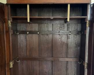 Mud Room in a Cabinet! Antique Cabinet Armoire with Blend of Gothic Revival and Federalist Styling. Interior Outfitted with Hooks For Hanging Coats. Measures 48” W x 15” D x 84” H. Photo 4 of 5.