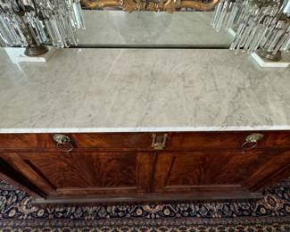 Antique Neoclassical Flame Mahogany Grand Buffet with Carrara Marble Top, Hidden Pull Out Tray and Brass Ormolu. Measures 65" W x 22" D x 38" H. Photo 2 of 9.