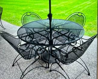 4ft round Frontgate outdoor table and chairs