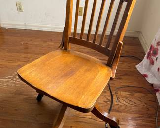 Vintage oak wooden desk chair with wheels