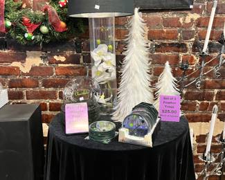 Black lamp shades, feather trees, bar height round tables