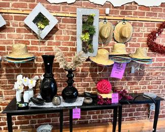 Tin planters with succulents, black 1/2 tables, garden hats